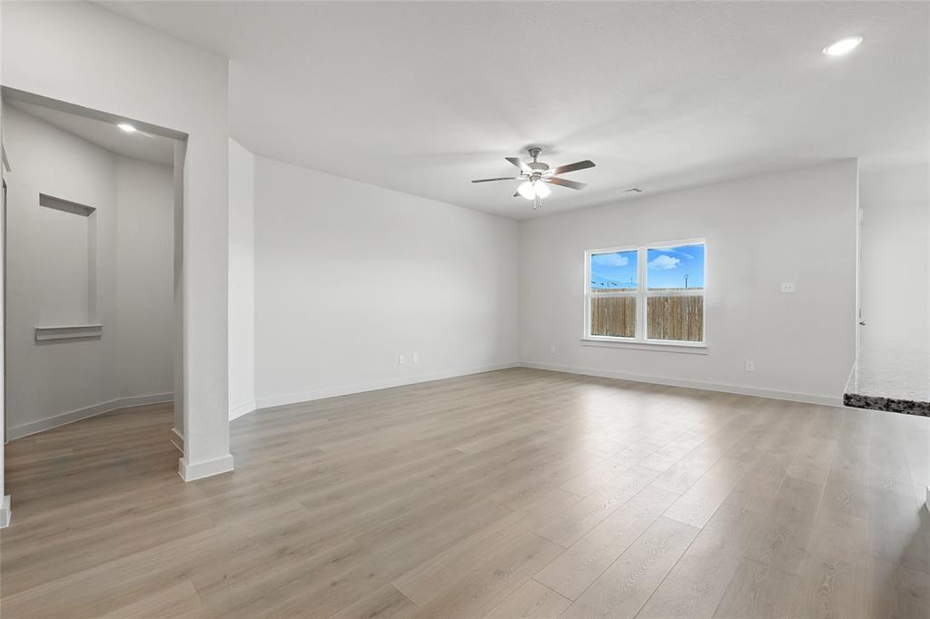 1795 Gleasondale Place Forney, TX 75126 - Photo 12 of 29 Unfurnished room with a ceiling fan, light wood-type flooring, and recessed lighting