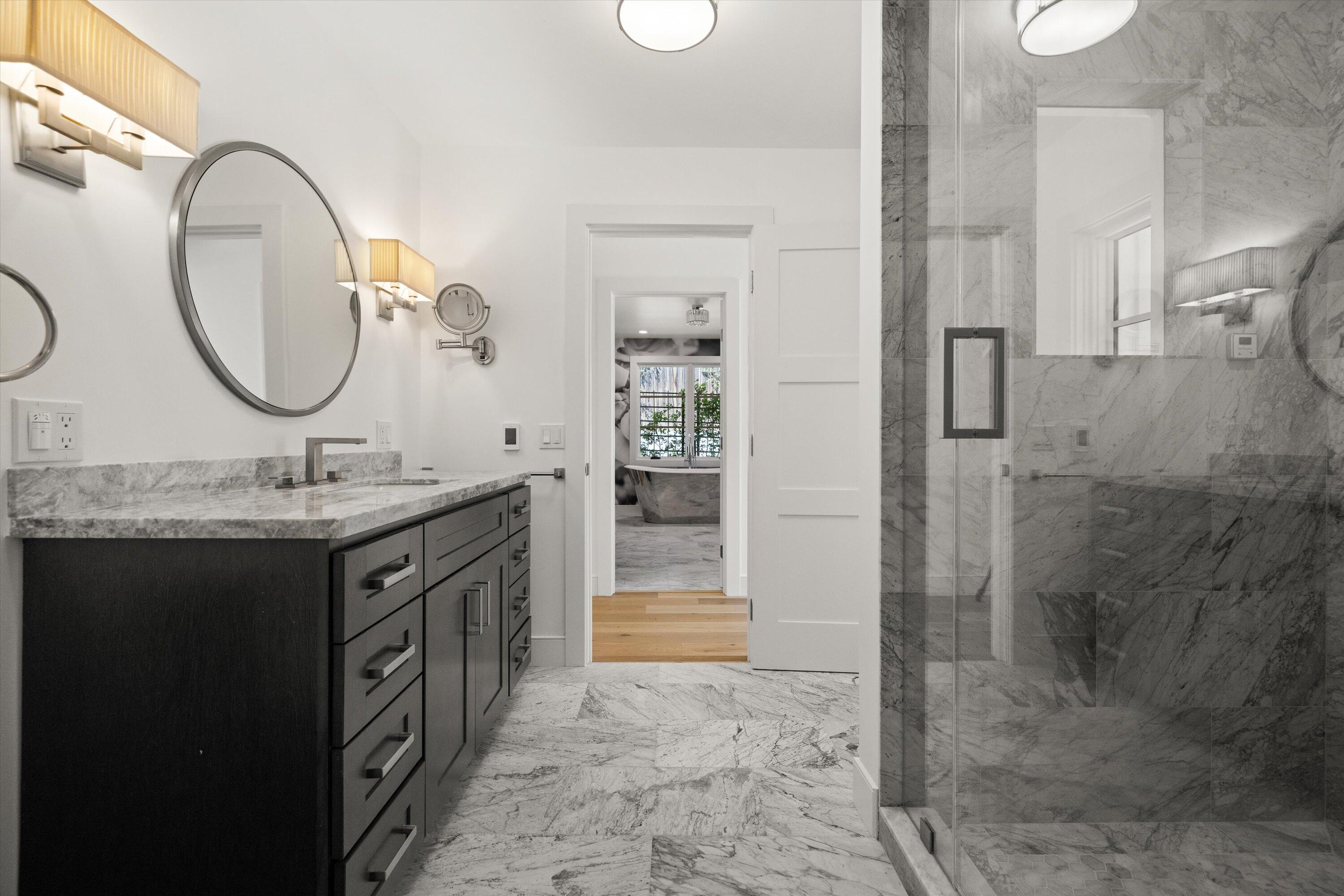 0 East Valley Road Montecito, CA 93108 - Photo 11 of 28 a bathroom with a granite countertop sink a mirror and a shower
