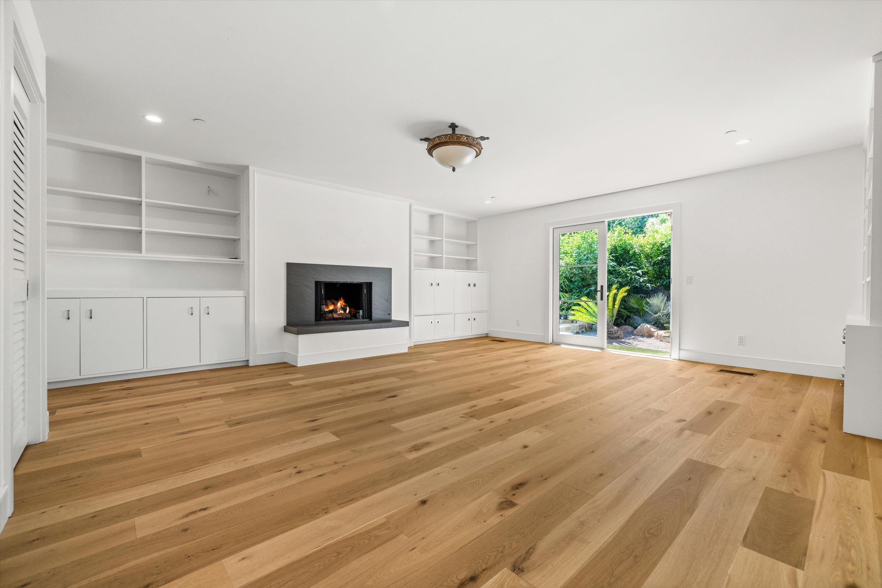 0 East Valley Road Montecito, CA 93108 - Photo 13 of 28 wooden floor fireplace and windows in an empty room