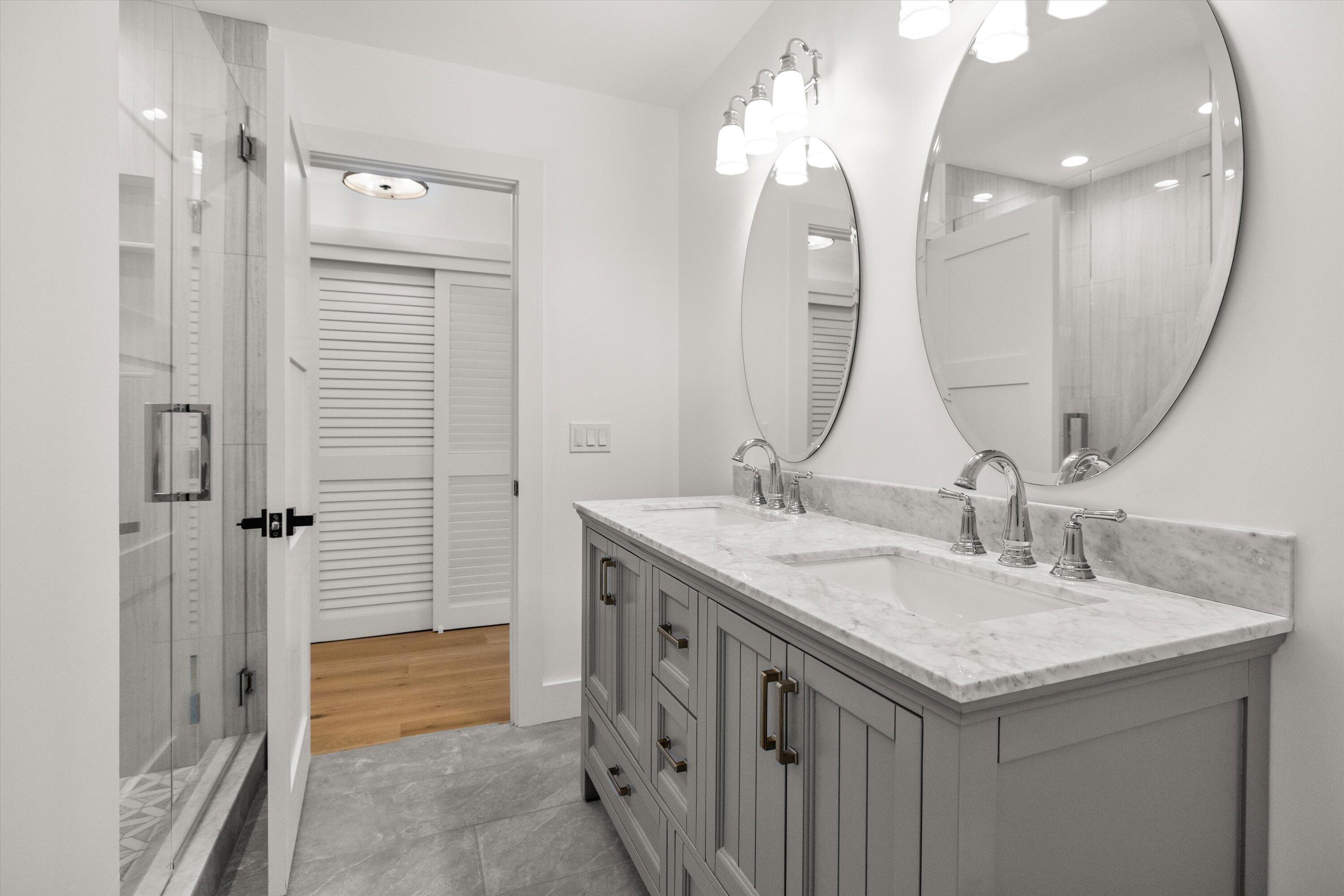 0 East Valley Road Montecito, CA 93108 - Photo 15 of 28 a bathroom with a granite countertop sink a large mirror and a shower