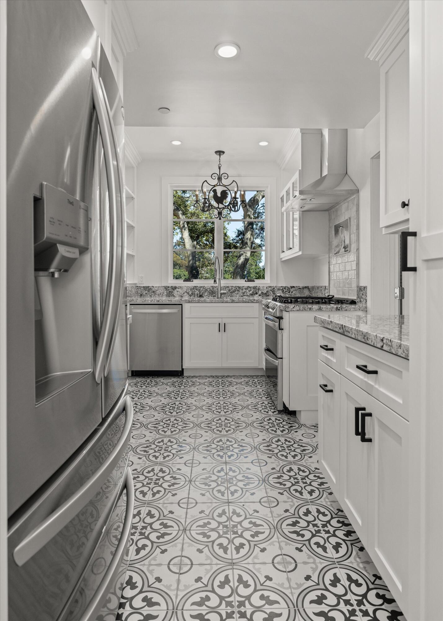 0 East Valley Road Montecito, CA 93108 - Photo 22 of 28 a kitchen with granite countertop a sink stove and cabinets