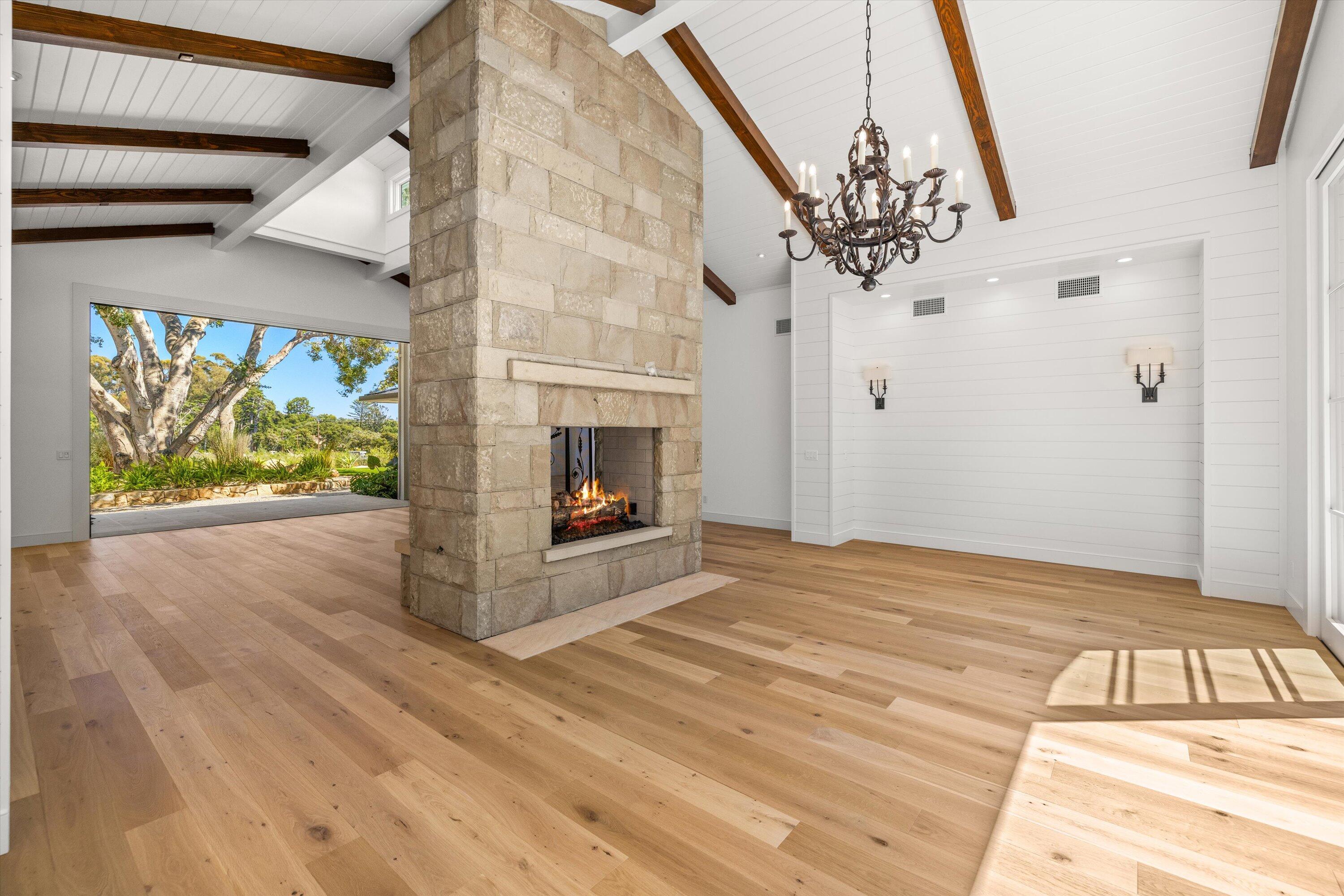 0 East Valley Road Montecito, CA 93108 - Photo 3 of 28 a view of an empty room with wooden floor and a fireplace