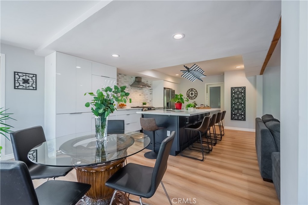19742 Cameron Avenue Covina, CA 91724 - Photo 12 of 48 a view of a dining room with furniture and wooden floor