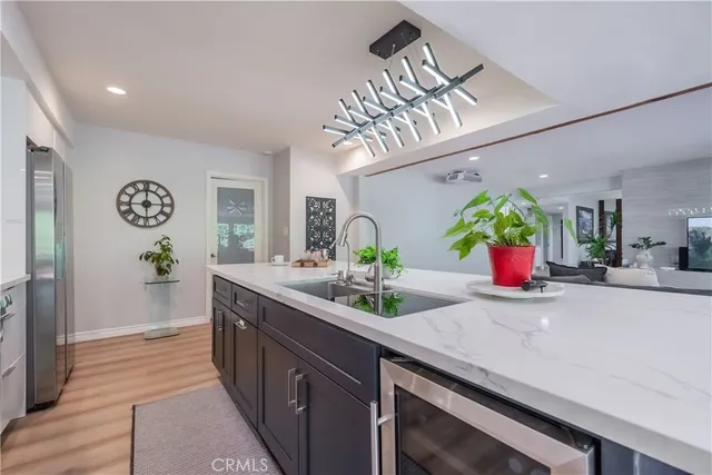 a kitchen with stainless steel appliances granite countertop a sink and dishwasher