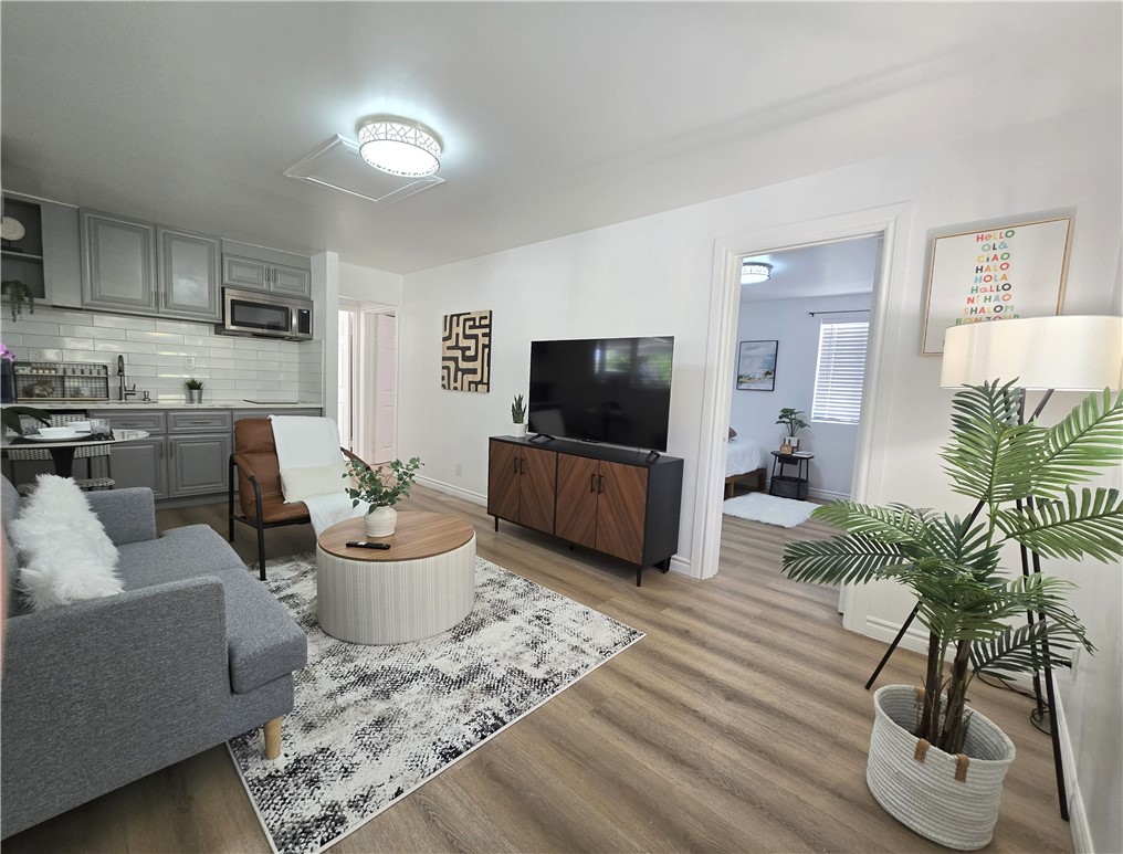 19742 Cameron Avenue Covina, CA 91724 - Photo 23 of 48 a living room with furniture and a flat screen tv