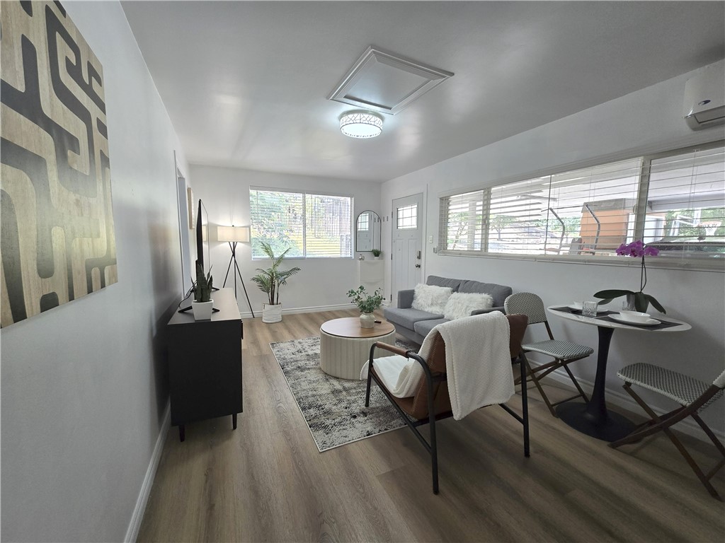 19742 Cameron Avenue Covina, CA 91724 - Photo 24 of 48 a living room with furniture and a large window