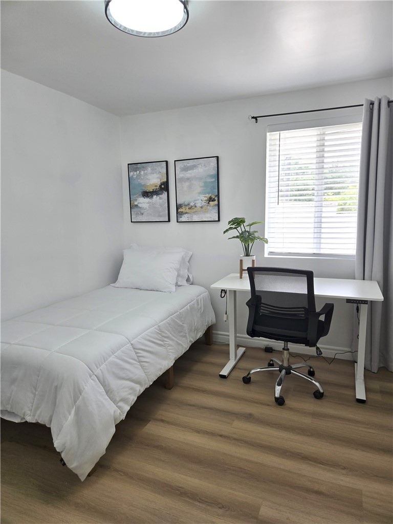 19742 Cameron Avenue Covina, CA 91724 - Photo 28 of 48 a bedroom with a bed a desk and chair