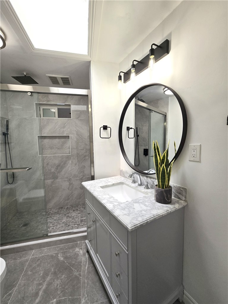 19742 Cameron Avenue Covina, CA 91724 - Photo 29 of 48 a bathroom with a sink and a mirror
