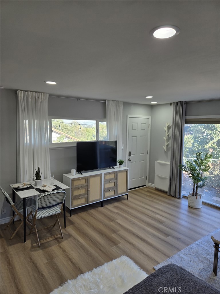 19742 Cameron Avenue Covina, CA 91724 - Photo 31 of 48 a living room with furniture and a flat screen tv