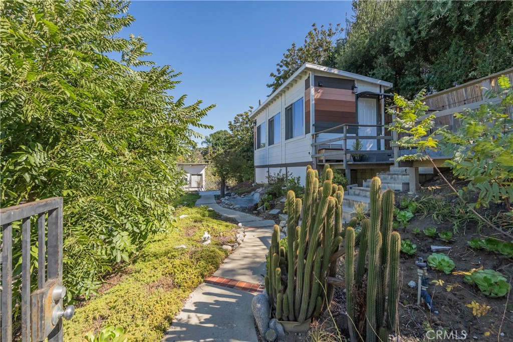 19742 Cameron Avenue Covina, CA 91724 - Photo 36 of 48 a view of a house with a small yard and plants