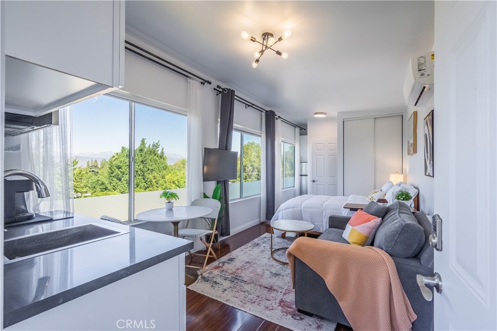 19742 Cameron Avenue Covina, CA 91724 - Photo 37 of 48 a living room with furniture potted plant and a large window