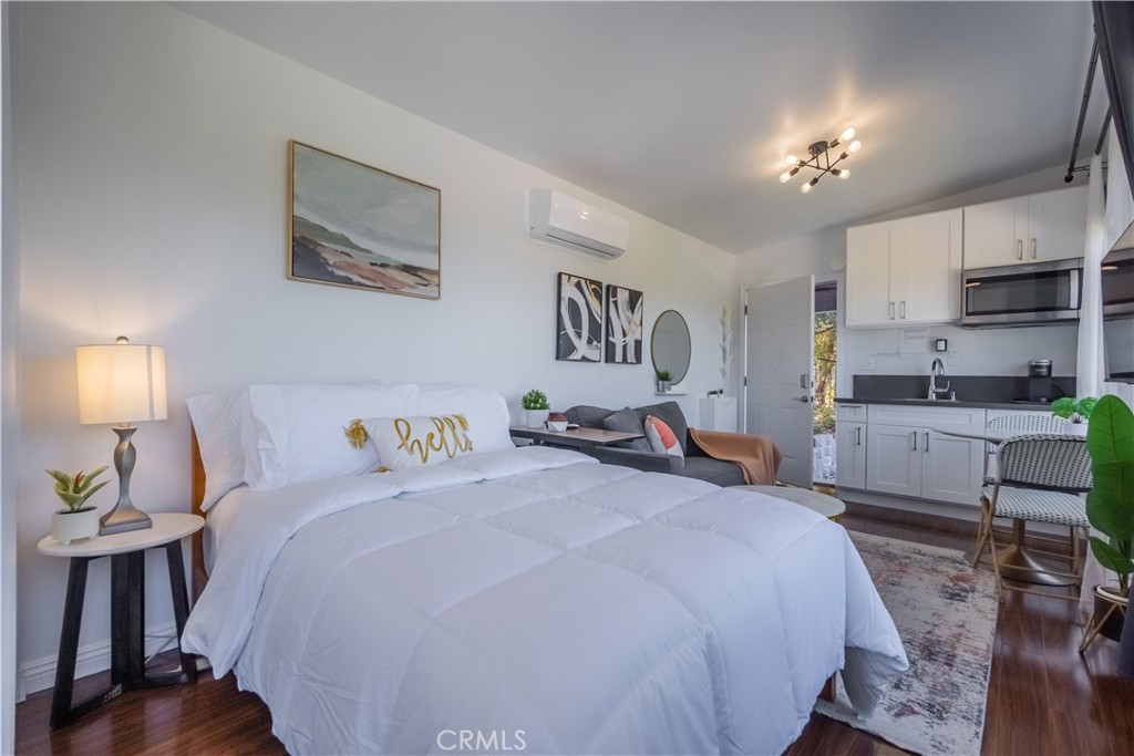 19742 Cameron Avenue Covina, CA 91724 - Photo 38 of 48 a bed room with a bed and a view of kitchen