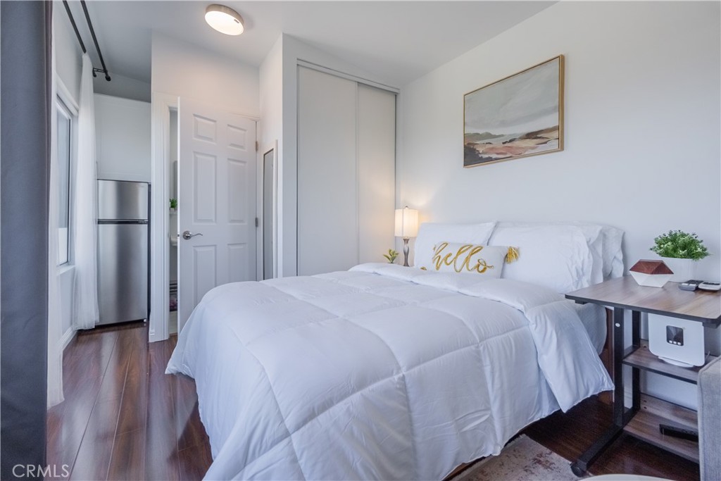 19742 Cameron Avenue Covina, CA 91724 - Photo 39 of 48 a bedroom with a bed and a table in it