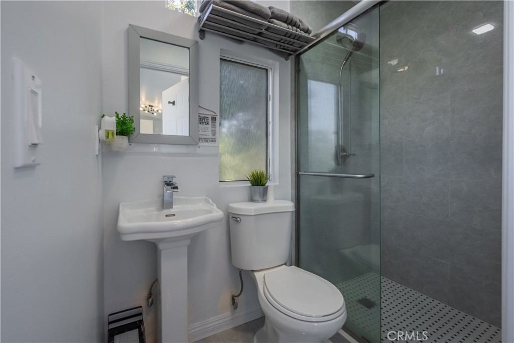 19742 Cameron Avenue Covina, CA 91724 - Photo 41 of 48 a bathroom with a sink toilet and shower