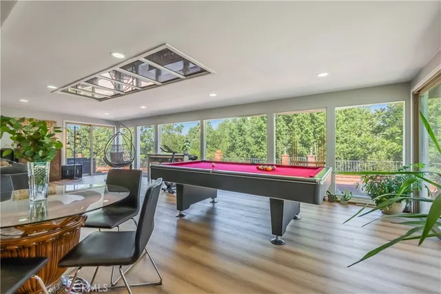 a room with lots of furniture and wooden floor