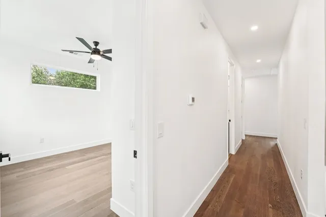 a view of a small space with wooden floor