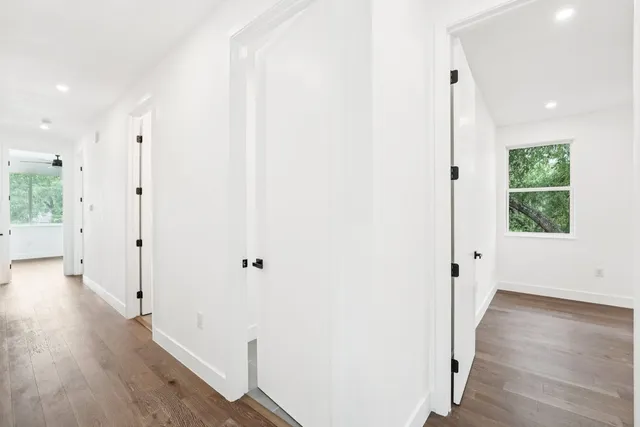 a bedroom with a large bed and a large window