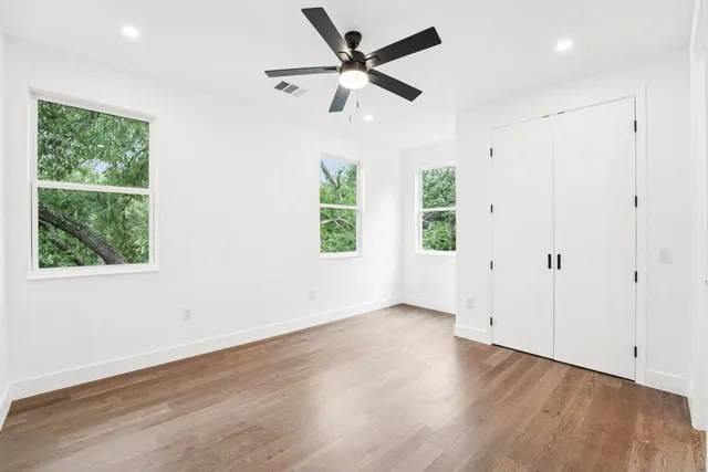 a view of a kitchen with wooden floor and a sink