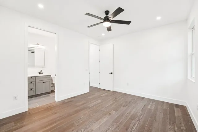 a bathroom with a double vanity sink mirror and shower