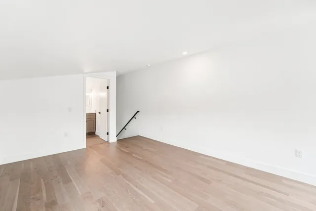 a bathroom with a double vanity sink mirror and toilet