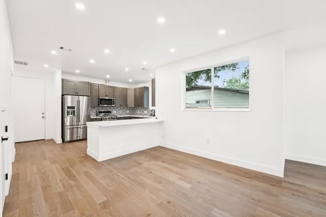 a view of kitchen with wooden floor