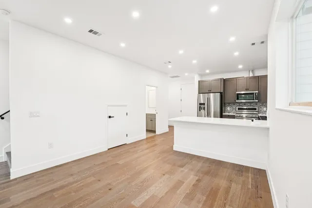 a view of kitchen with wooden floor