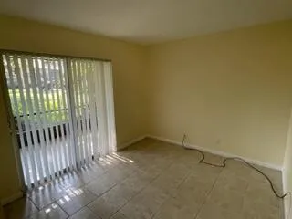 a kitchen with stainless steel appliances granite countertop a refrigerator a stove and a sink