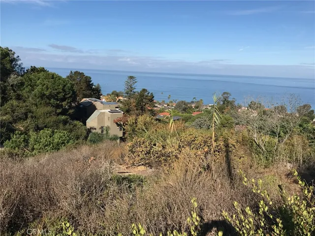 a view of a lake with a building in back