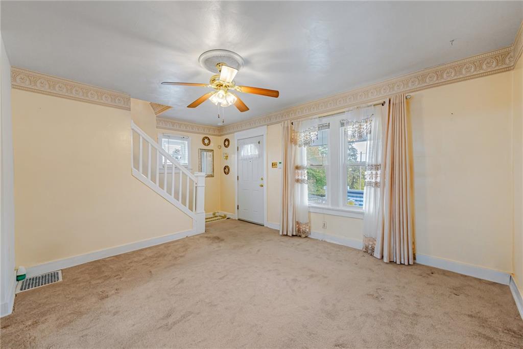 2539 Mahon Street Pittsburgh, PA 15219 - Photo 11 of 24 an empty room with windows and ceiling fan