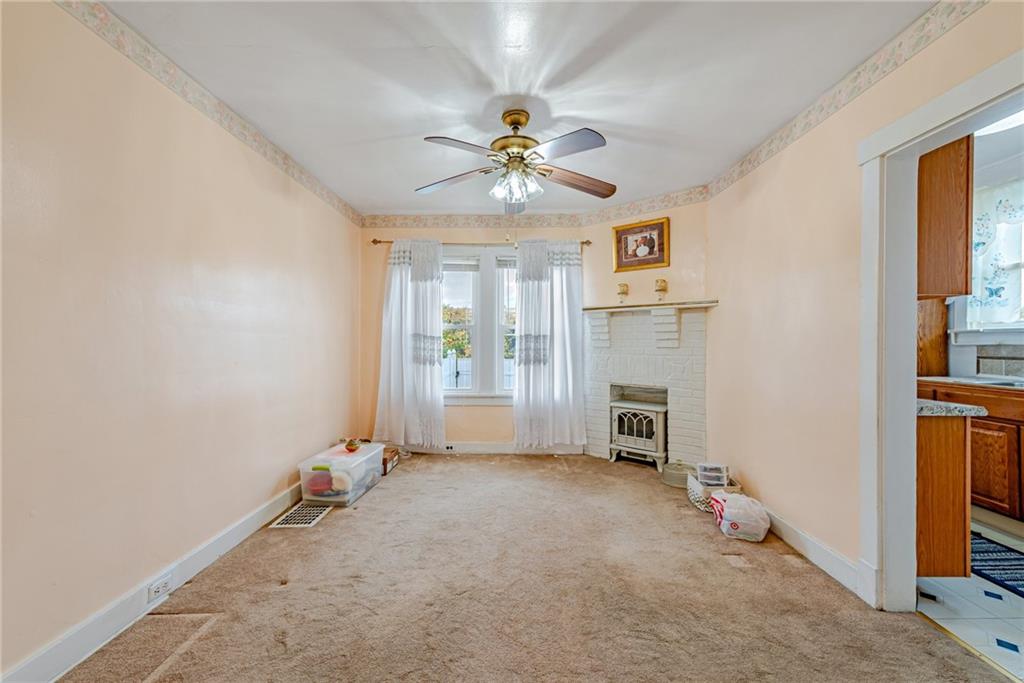 2539 Mahon Street Pittsburgh, PA 15219 - Photo 12 of 24 an empty room with fireplace and windows