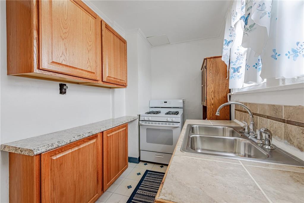 2539 Mahon Street Pittsburgh, PA 15219 - Photo 14 of 24 a kitchen with stainless steel appliances granite countertop a sink and a microwave