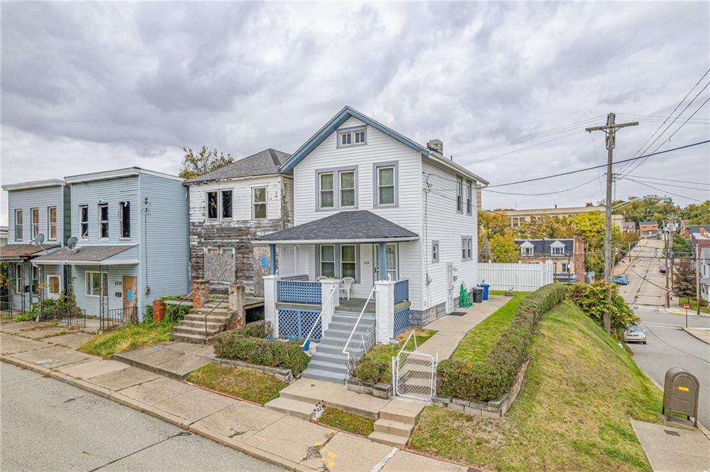 2539 Mahon Street Pittsburgh, PA 15219 - Photo 2 of 24 a front view of a house with a yard