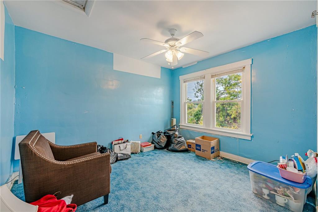 2539 Mahon Street Pittsburgh, PA 15219 - Photo 22 of 24 a living room with furniture and a window