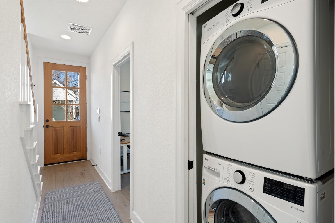 209 Ben Howell Drive, Unit B Austin, TX 78704 - Photo 11 of 39 a view of a hallway with washer and dryer