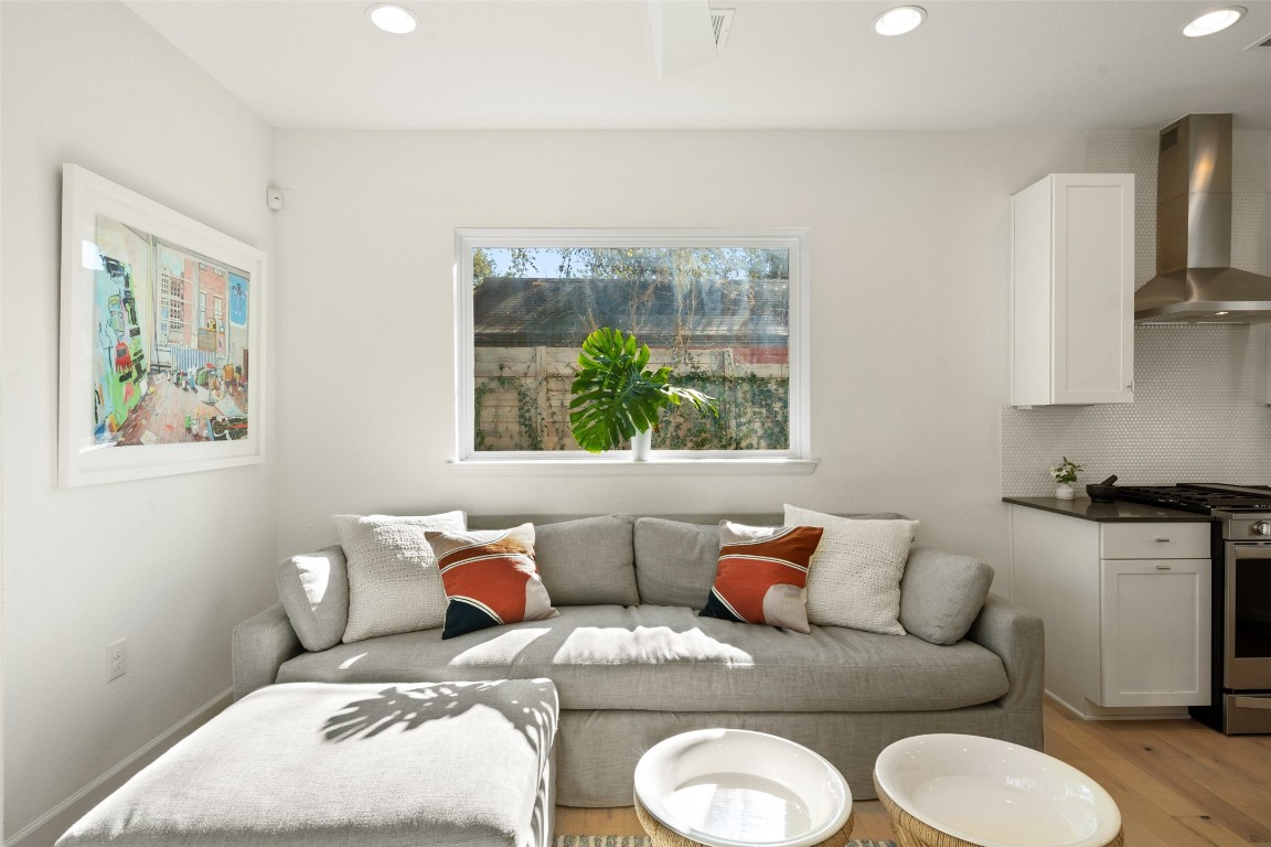 209 Ben Howell Drive, Unit B Austin, TX 78704 - Photo 12 of 39 a living room with furniture and a large window