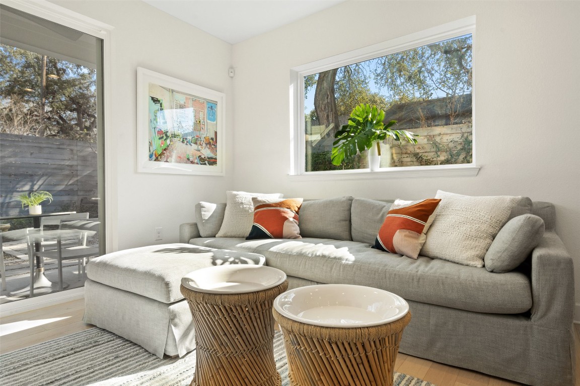 209 Ben Howell Drive, Unit B Austin, TX 78704 - Photo 13 of 39 a living room with furniture and a wall painting