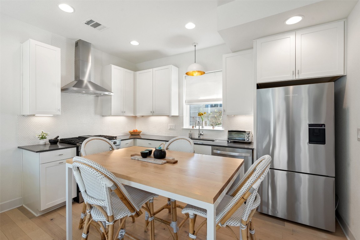 209 Ben Howell Drive, Unit B Austin, TX 78704 - Photo 16 of 39 a kitchen with refrigerator a stove a sink and a refrigerator