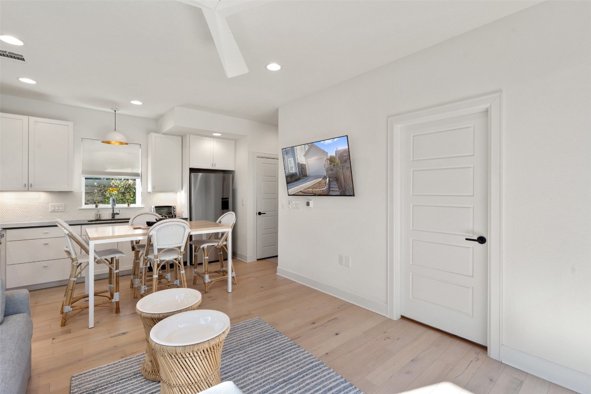 209 Ben Howell Drive, Unit B Austin, TX 78704 - Photo 21 of 39 a dining room with furniture a rug and wooden floor