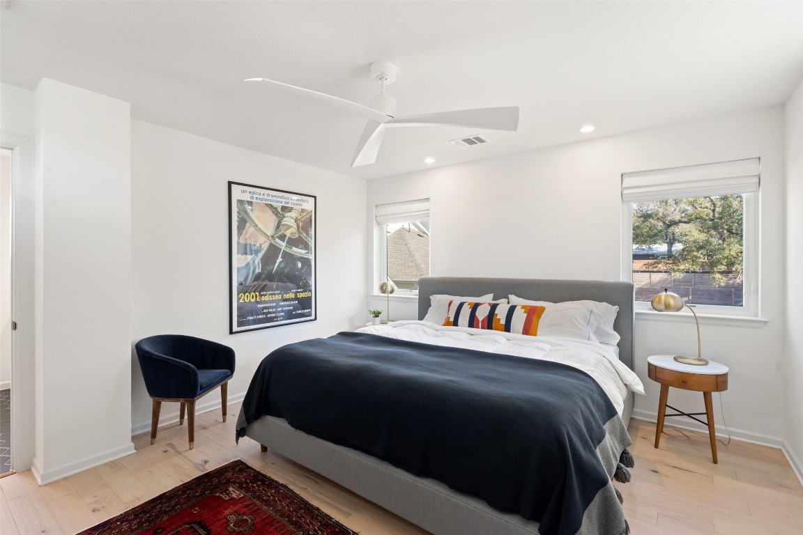 209 Ben Howell Drive, Unit B Austin, TX 78704 - Photo 30 of 39 a bedroom with a bed and a window