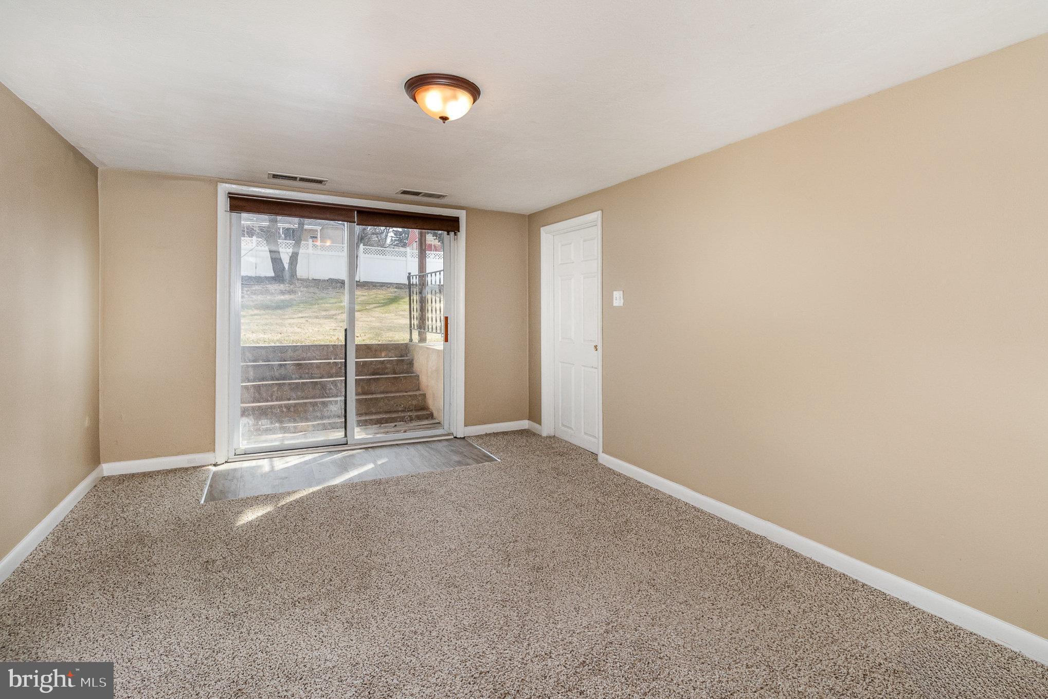 2540 Raleigh Drive York, PA 17402 - Photo 10 of 37 Family room on Main level access to back yard