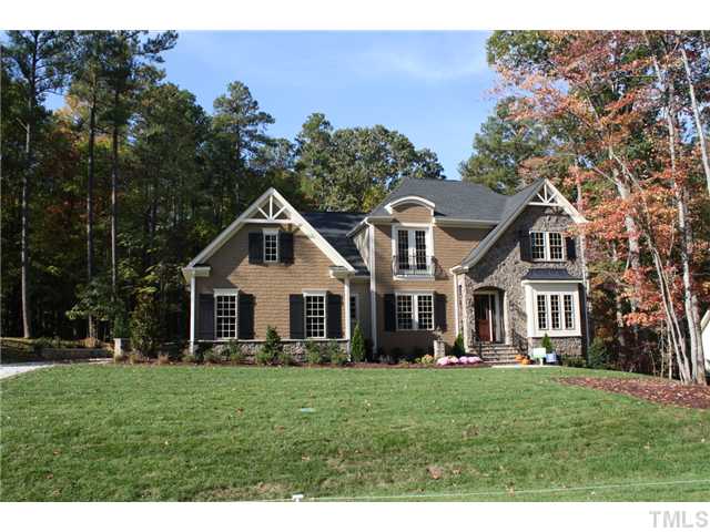 6829 Mactavish Way Raleigh, NC 27613 - Photo 1 of 25 a front view of a house with a yard