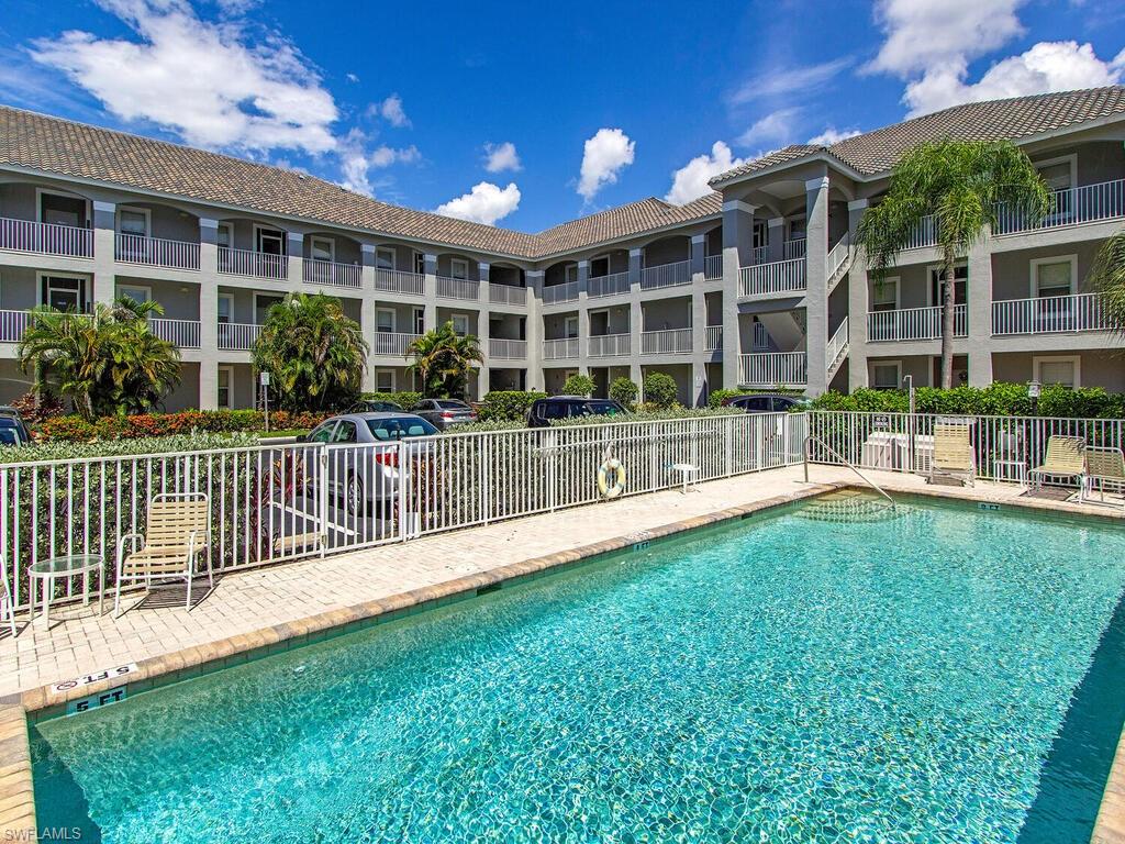 a view of a house with backyard and porch