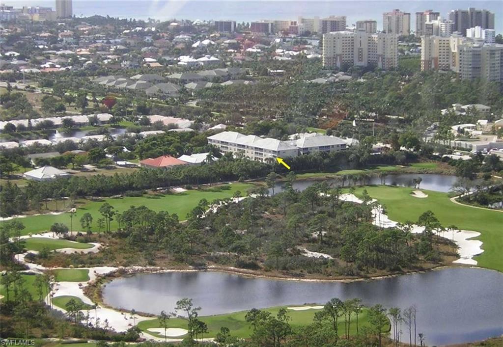 519 Roma Court, Unit 3201 Naples, FL 34110 - Photo 16 of 17 a view of a lake with a city