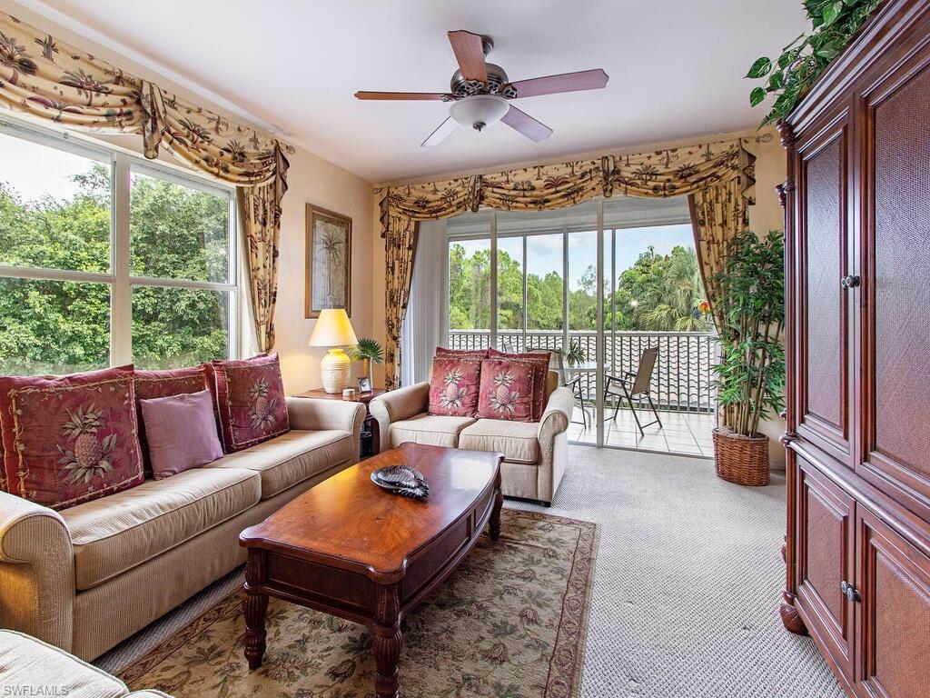 519 Roma Court, Unit 3201 Naples, FL 34110 - Photo 3 of 17 a living room with furniture and a large window