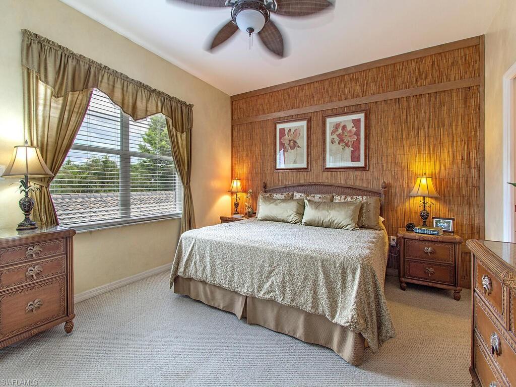 519 Roma Court, Unit 3201 Naples, FL 34110 - Photo 8 of 17 a bedroom with a bed dresser and a window