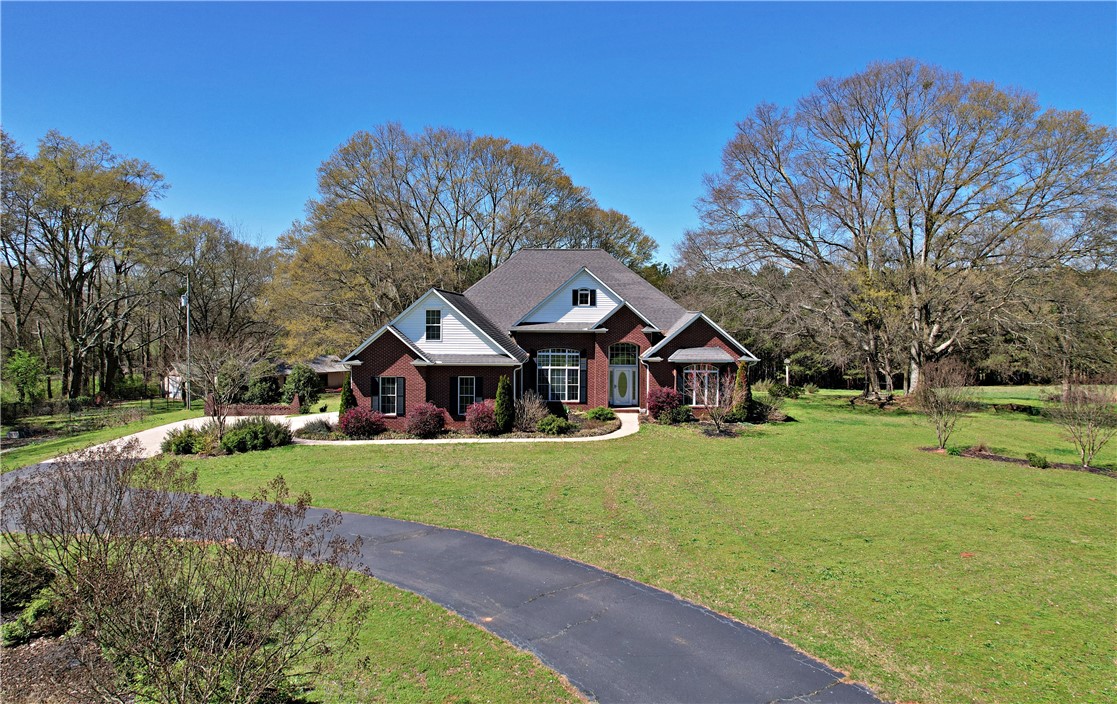 7893 Athens Road Carnesville, GA 30521 - Photo 40 of 50 This classic brick residence boasts a sweeping driveway and lush, expansive grounds.
