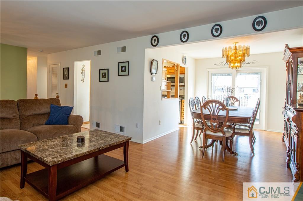 7 Fulton Road Somerset, NJ 08873 - Photo 2 of 24 a living room with furniture and wooden floor