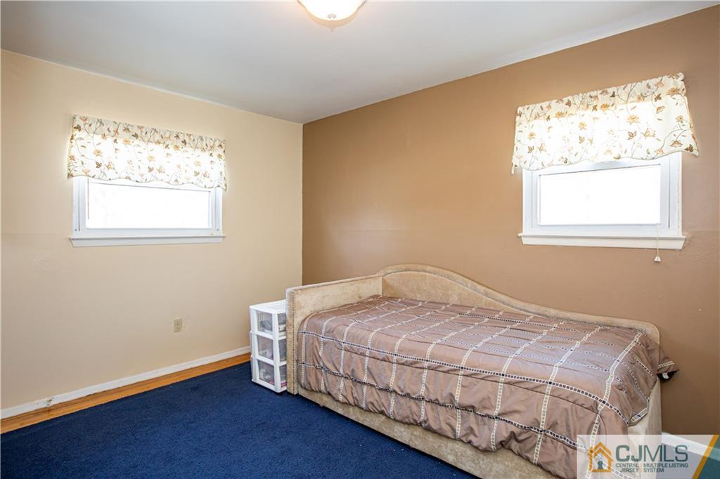 7 Fulton Road Somerset, NJ 08873 - Photo 12 of 24 a bedroom with a bed and a window