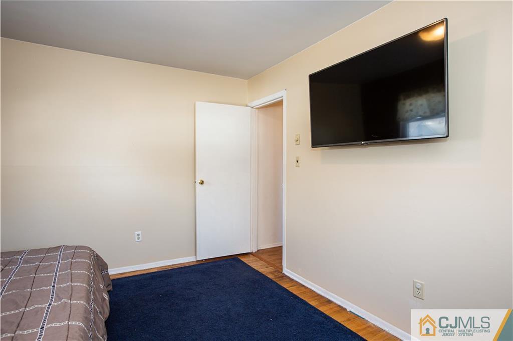 7 Fulton Road Somerset, NJ 08873 - Photo 13 of 24 a view of empty room with wooden floor and fan