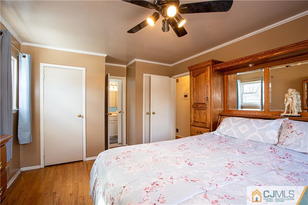 7 Fulton Road Somerset, NJ 08873 - Photo 16 of 24 a bedroom with a bed and a chandelier